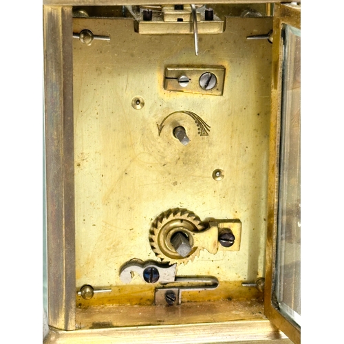 11 - A late 19th century brass carriage clock with case.