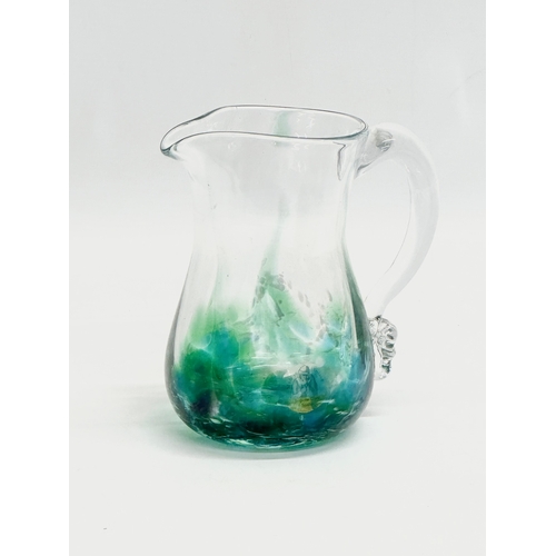 397 - An Irish Art Glass ‘Seascape’ jug by Jerpoint Glass. 14x9x15cm