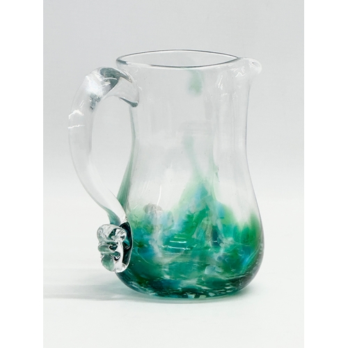 397 - An Irish Art Glass ‘Seascape’ jug by Jerpoint Glass. 14x9x15cm