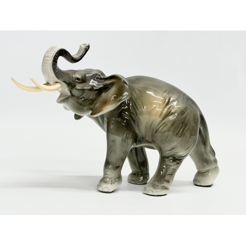 396 - A Royal Dux pottery elephant. 23x15cm