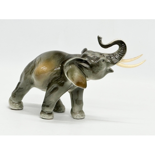 396 - A Royal Dux pottery elephant. 23x15cm