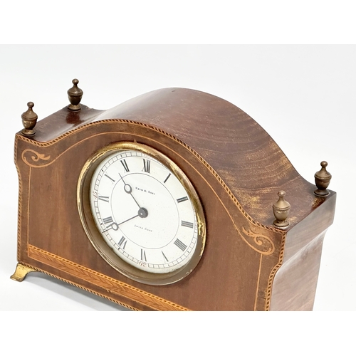 68 - A late 19th/early 20th century inlaid mahogany mantle clock by Reid & Sons. Swiss made. Circa 1890-1... 