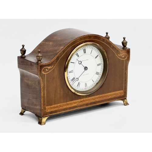 68 - A late 19th/early 20th century inlaid mahogany mantle clock by Reid & Sons. Swiss made. Circa 1890-1... 