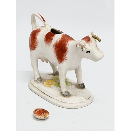 22 - A late 19th century Victorian Staffordshire pottery Cow Creamer. 16x13cm