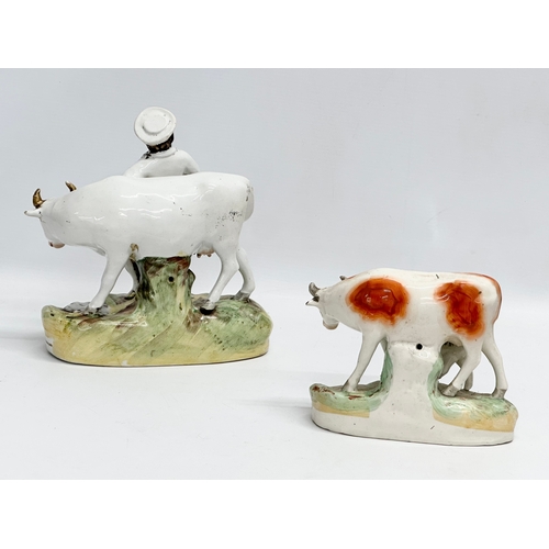 24 - 2 19th century Victorian Staffordshire cows. 21x21.5cm