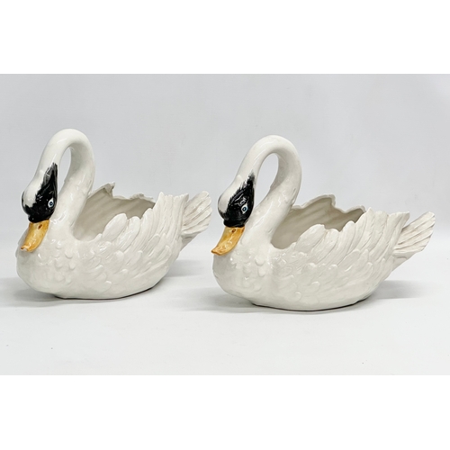 395 - A pair of vintage pottery swan planters. 35x16x22cm