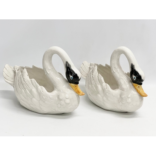 395 - A pair of vintage pottery swan planters. 35x16x22cm