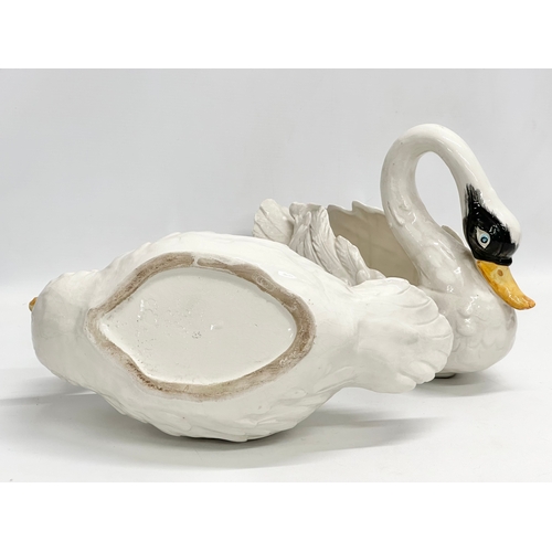 395 - A pair of vintage pottery swan planters. 35x16x22cm