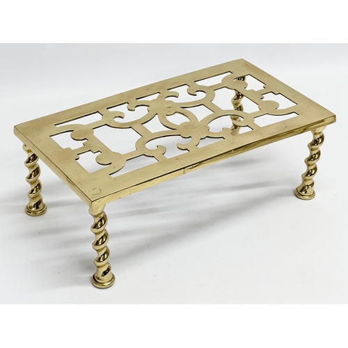 394 - 2 Victorian brass trivet stands and other. 30.5x16.5x11.5cm. Irish clover with paw feet 20x4.5cm