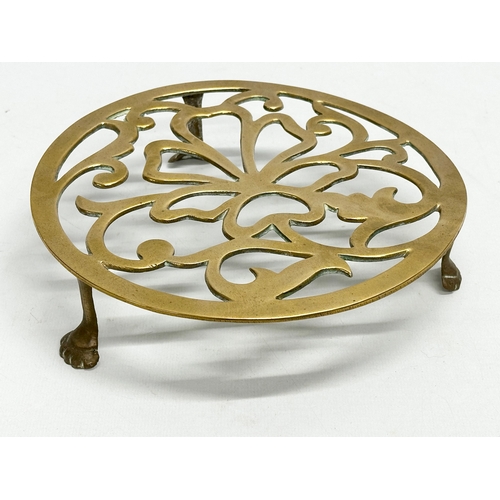 394 - 2 Victorian brass trivet stands and other. 30.5x16.5x11.5cm. Irish clover with paw feet 20x4.5cm