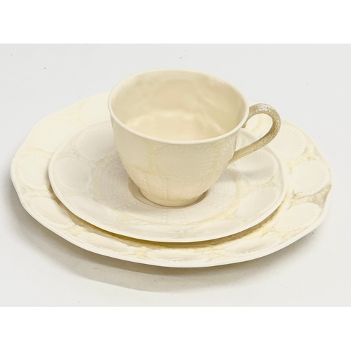 30 - A 3rd Period Belleek ‘Tridacna’ trio cup and saucers. 20cm