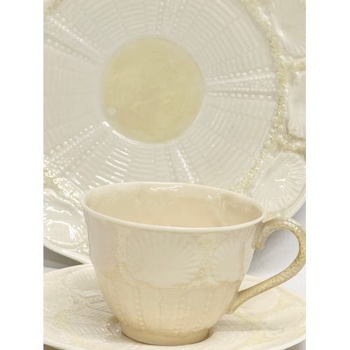 30 - A 3rd Period Belleek ‘Tridacna’ trio cup and saucers. 20cm