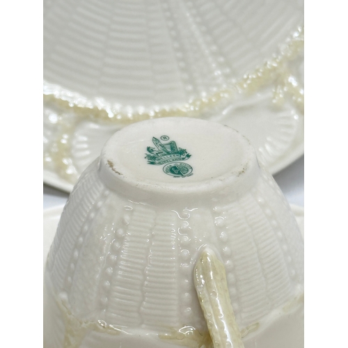 30 - A 3rd Period Belleek ‘Tridacna’ trio cup and saucers. 20cm