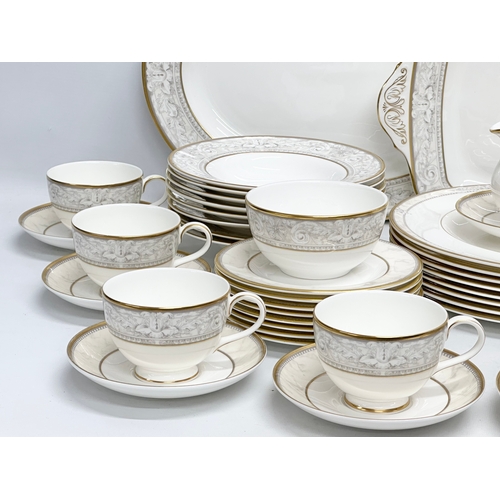 389 - A 56 piece Royal Doulton ‘Naples’ dinner service. A pair of large meat platters 41x31.5cm. A 2 handl... 