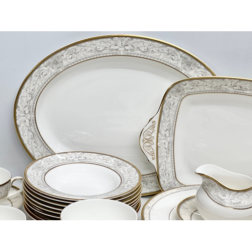 389 - A 56 piece Royal Doulton ‘Naples’ dinner service. A pair of large meat platters 41x31.5cm. A 2 handl... 