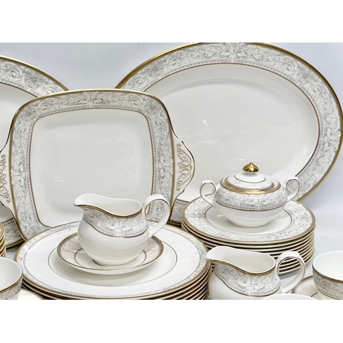 389 - A 56 piece Royal Doulton ‘Naples’ dinner service. A pair of large meat platters 41x31.5cm. A 2 handl... 