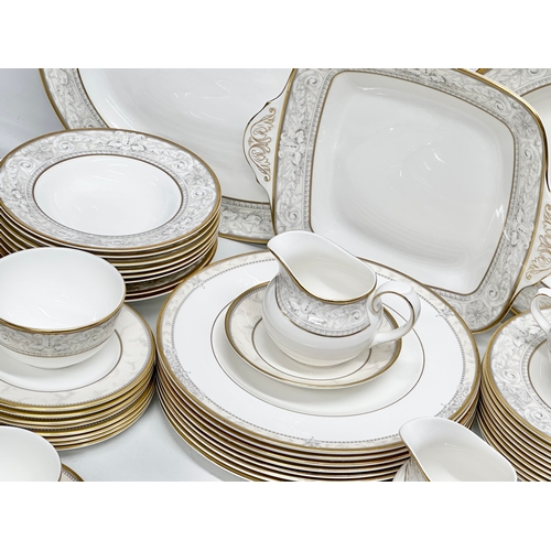 389 - A 56 piece Royal Doulton ‘Naples’ dinner service. A pair of large meat platters 41x31.5cm. A 2 handl... 