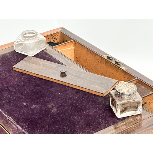 79 - A Victorian rosewood writing slope with Mother of Pearl inlay. Closed 35.5x25x15cm. Open 50cm.