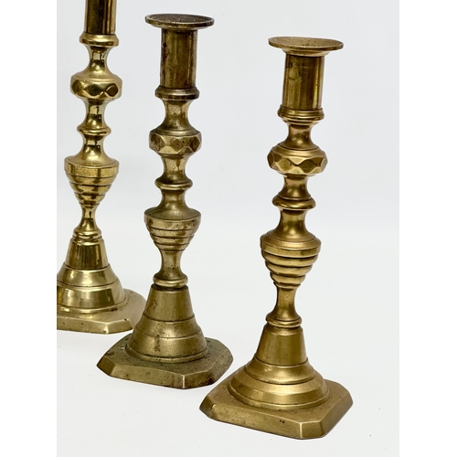 387 - 3 pairs of Victorian brass candlesticks. 24cm.