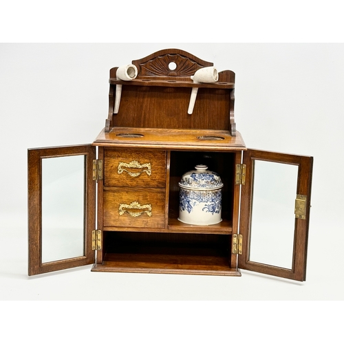 84 - A late Victorian oak humidor. 28.5x18x41.5cm