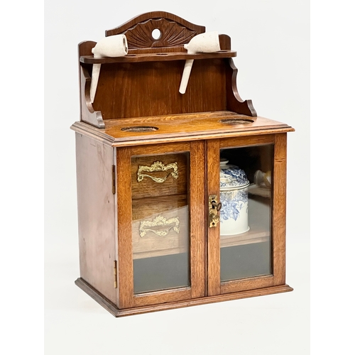 84 - A late Victorian oak humidor. 28.5x18x41.5cm