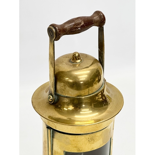 89 - An early 20th century Sherwood Limited brass ships lamp. 26cm including handle.