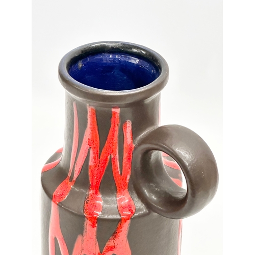 379 - A Mid Century West German drip glazed Scheurich vase with handle and blue glazed interior. 401-28. 2... 