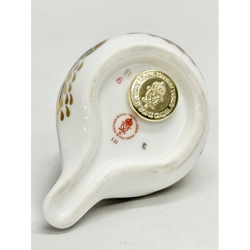 374 - A Royal Crown Derby porcelain robin paperweight. An Mdina Seahorse paperweight and a 1968 West Germa... 