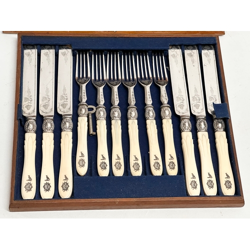 118 - An early 20th century silver plated cutlery set with bone handles in mahogany case. 29x26cm