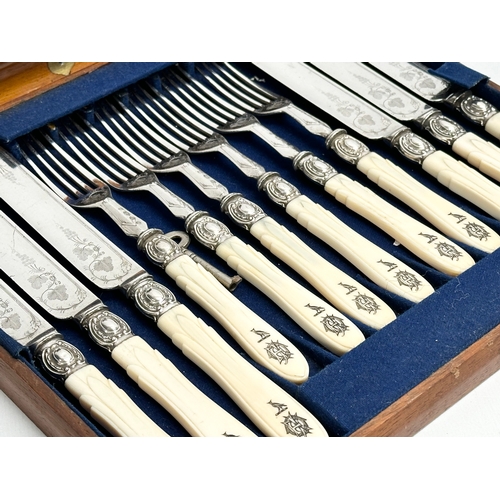 118 - An early 20th century silver plated cutlery set with bone handles in mahogany case. 29x26cm