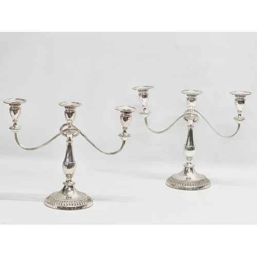 366 - A pair of vintage silver plated candelabras. 37x29cm