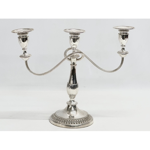 366 - A pair of vintage silver plated candelabras. 37x29cm