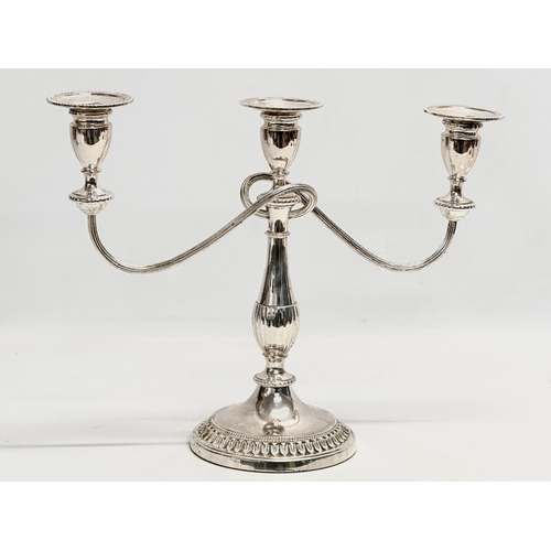 366 - A pair of vintage silver plated candelabras. 37x29cm