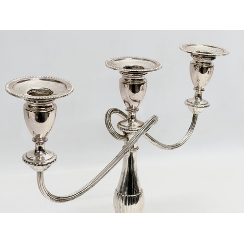 366 - A pair of vintage silver plated candelabras. 37x29cm