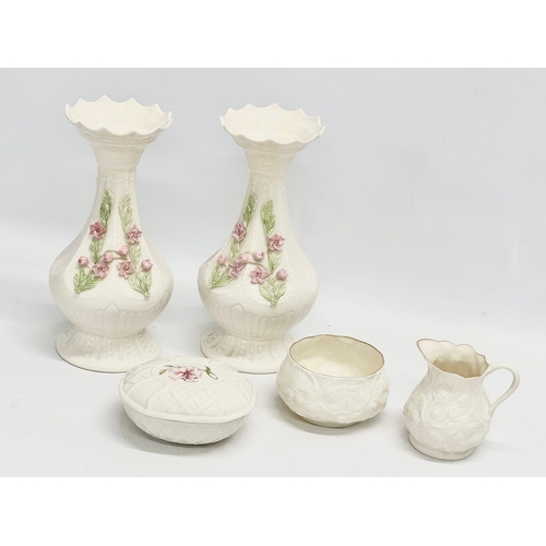 651 - 5 pieces of Belleek Pottery. Vases 21cm