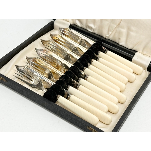 652 - A set of early 20th century ornate silver plated cutlery in case by H. Fisher & Co. Circa 1929.