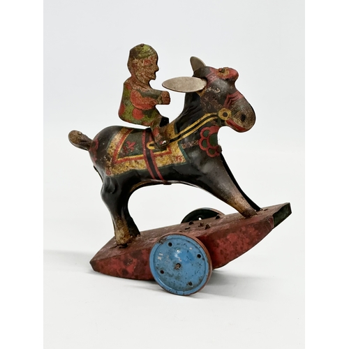 434 - A vintage ‘Peter Pan’ series Stubborn mechanical rocking clown on horse. 15x17cm