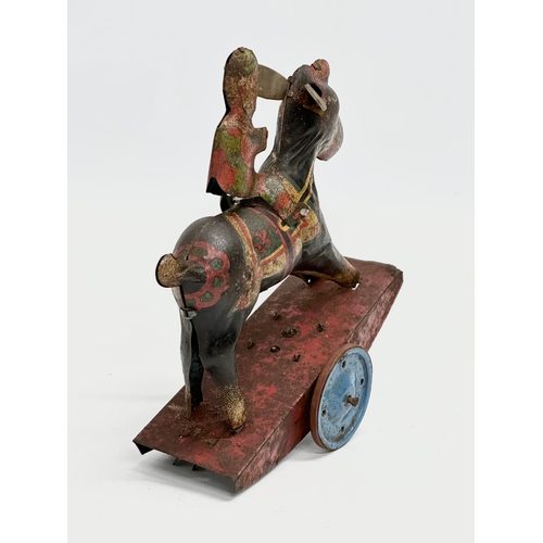 434 - A vintage ‘Peter Pan’ series Stubborn mechanical rocking clown on horse. 15x17cm