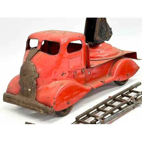 436 - A vintage Tri-ang tin plate fire truck. 24cm