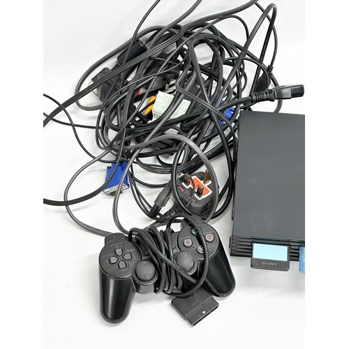 439 - A PlayStation 2 with controller and leads.