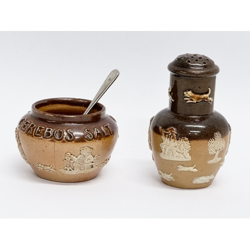 429 - An early 20th century Royal Doulton Lambeth 2 piece condiment set. Salt and pepper shaker.