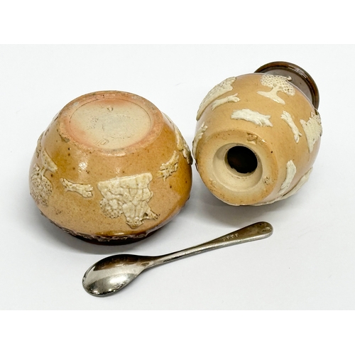 429 - An early 20th century Royal Doulton Lambeth 2 piece condiment set. Salt and pepper shaker.