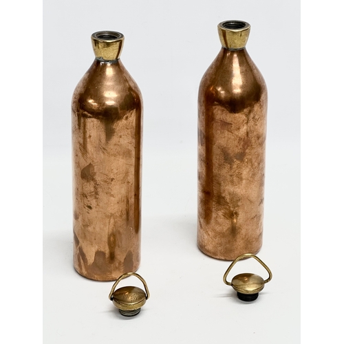 428 - A pair of late 19th/early 20th century copper hot water bottles. 30cm