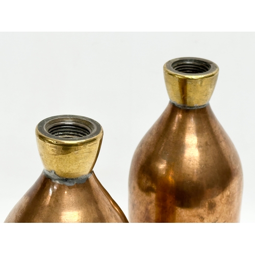 428 - A pair of late 19th/early 20th century copper hot water bottles. 30cm