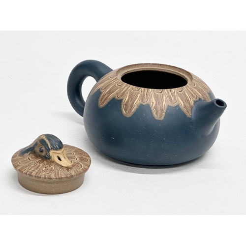 425 - A Chinese Yixing clay duck design teapot. Impressed mark. 15x10x9cm