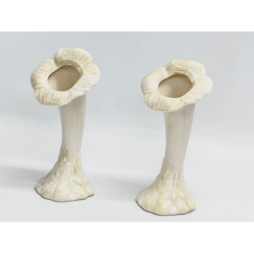 658 - A collection of pottery. A pair of 4th period Belleek pottery sunflower trumpet vases 19.5cm. A larg... 