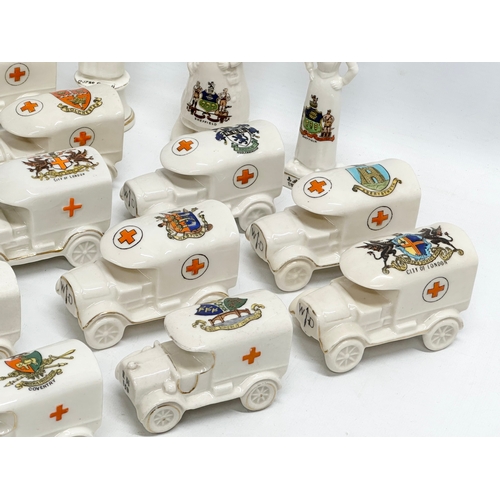 422 - A collection of early 20th century crested china WWI WD trucks and nurses. Including a Nurse Cavell ... 