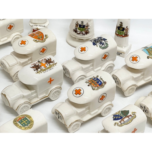 422 - A collection of early 20th century crested china WWI WD trucks and nurses. Including a Nurse Cavell ... 