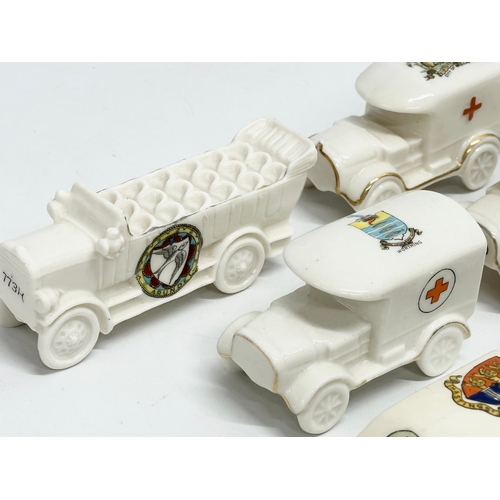 422 - A collection of early 20th century crested china WWI WD trucks and nurses. Including a Nurse Cavell ... 