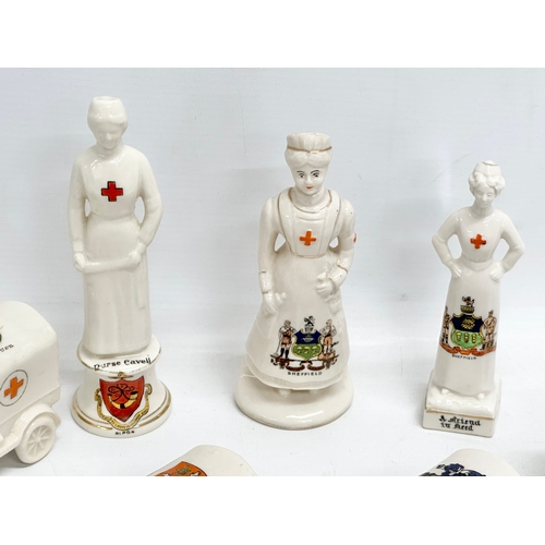 422 - A collection of early 20th century crested china WWI WD trucks and nurses. Including a Nurse Cavell ... 